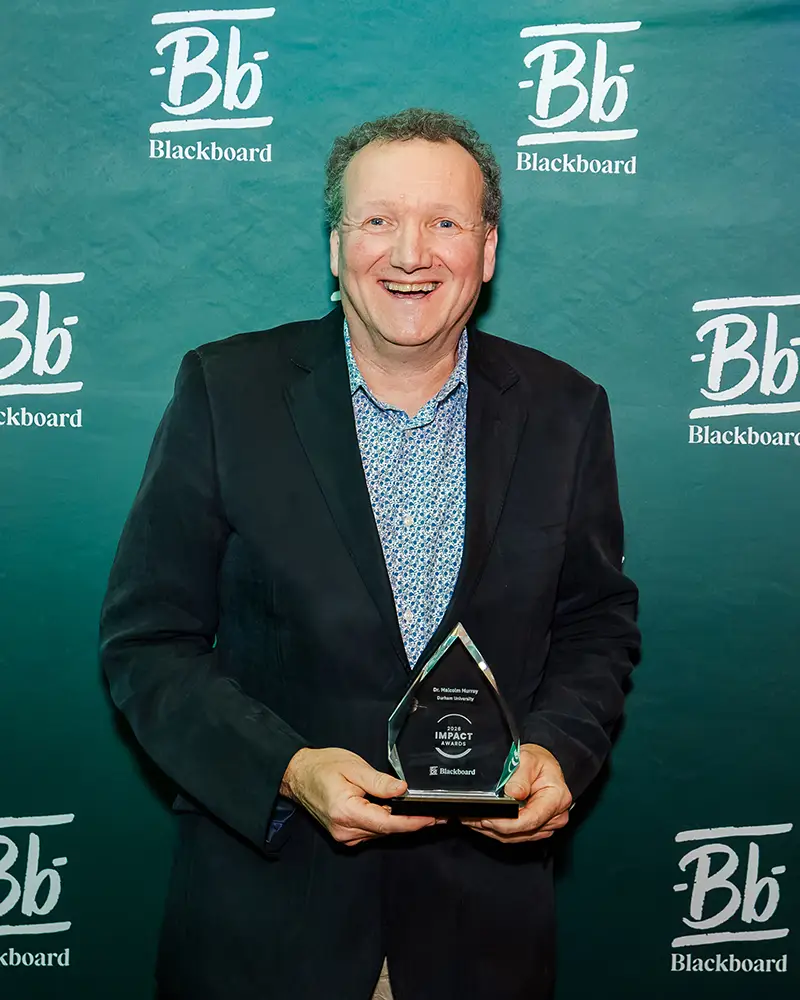 Dr. Malcolm Murray from Durham University accepting his Catalyst Award at Building Blackboard Together