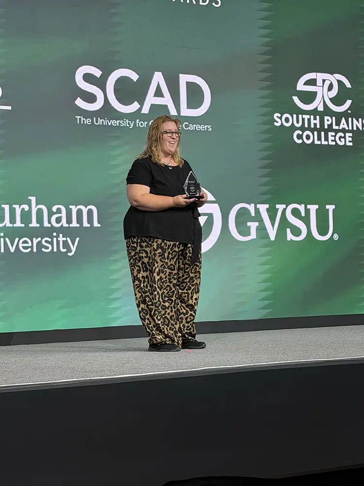 Heather Medley accepting her Catalyst Award at Building Blackboard Together