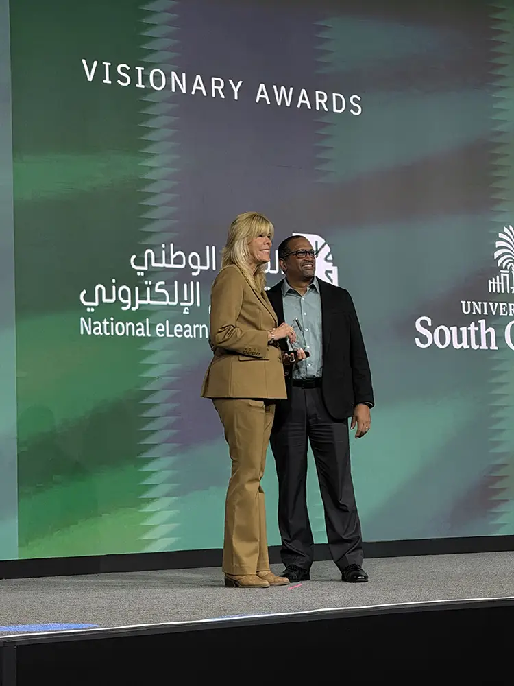 Representatives from Keiser University accepting their Catalyst Award at Building Blackboard Together