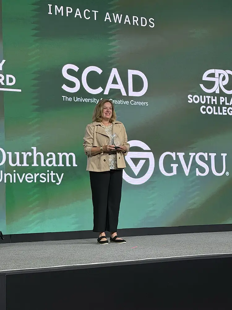 Kim Kenward accepting her Catalyst Award at Building Blackboard Together