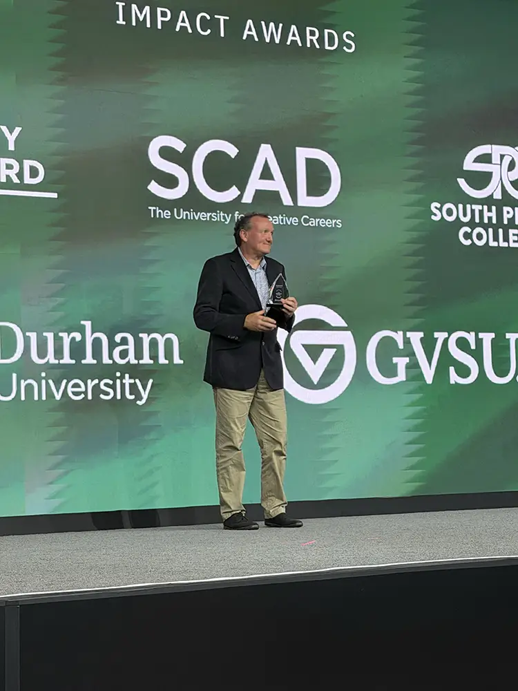 Dr. Malcolm Murray from Durham University accepting his Catalyst Award at Building Blackboard Together