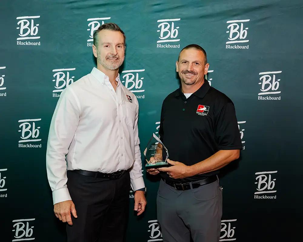 Representatives from National Aviation Academy accepting their Catalyst Award at Building Blackboard Together