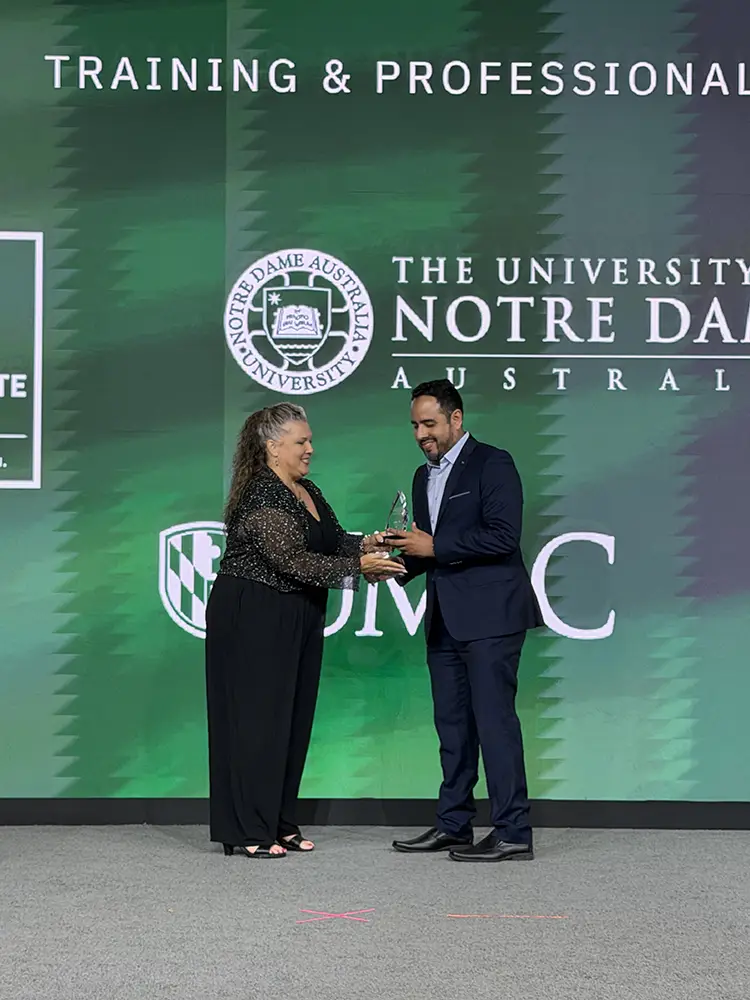 Representative from Universidad del Pacifico accepting their Catalyst Award at Building Blackboard Together