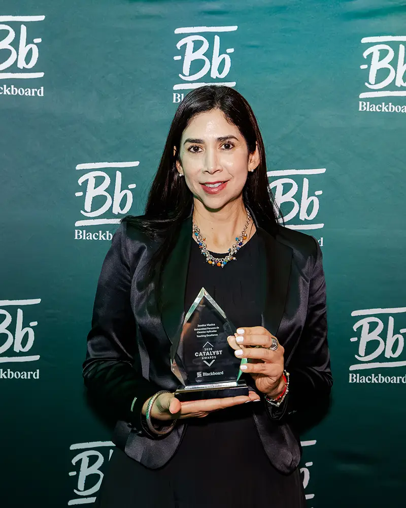 Representative from Universidad Peruana de Ciencias Aplicadas accepting their Catalyst Award at Building Blackboard Together