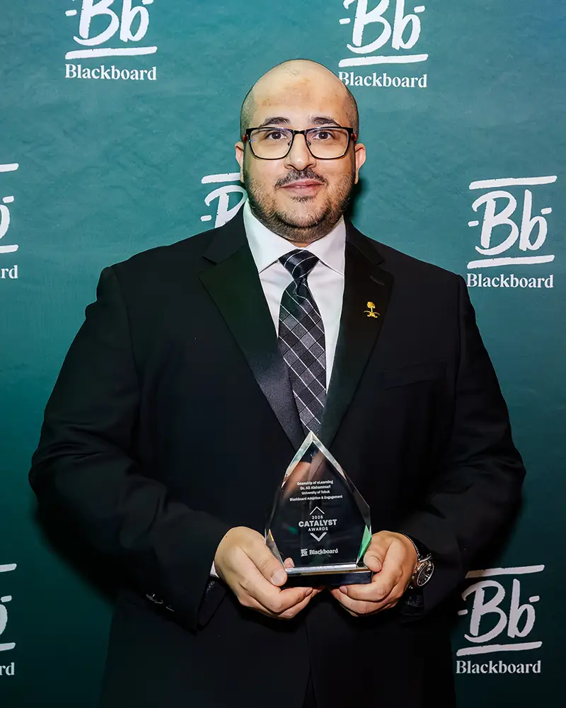 Representative from The University of Tabuk accepting their Catalyst Award at Building Blackboard Together
